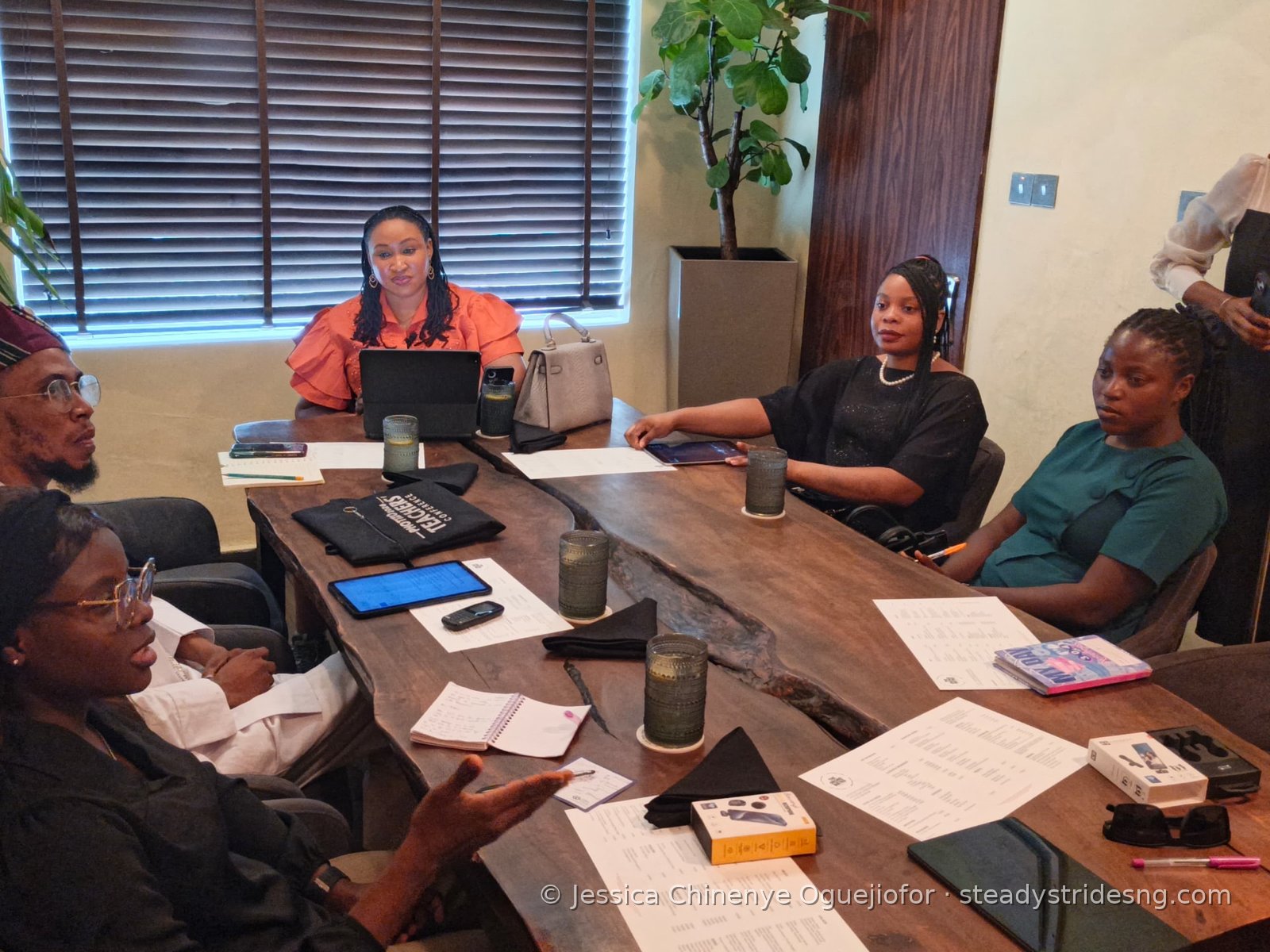 Guests around the table listening during the breakfast meeting discussion